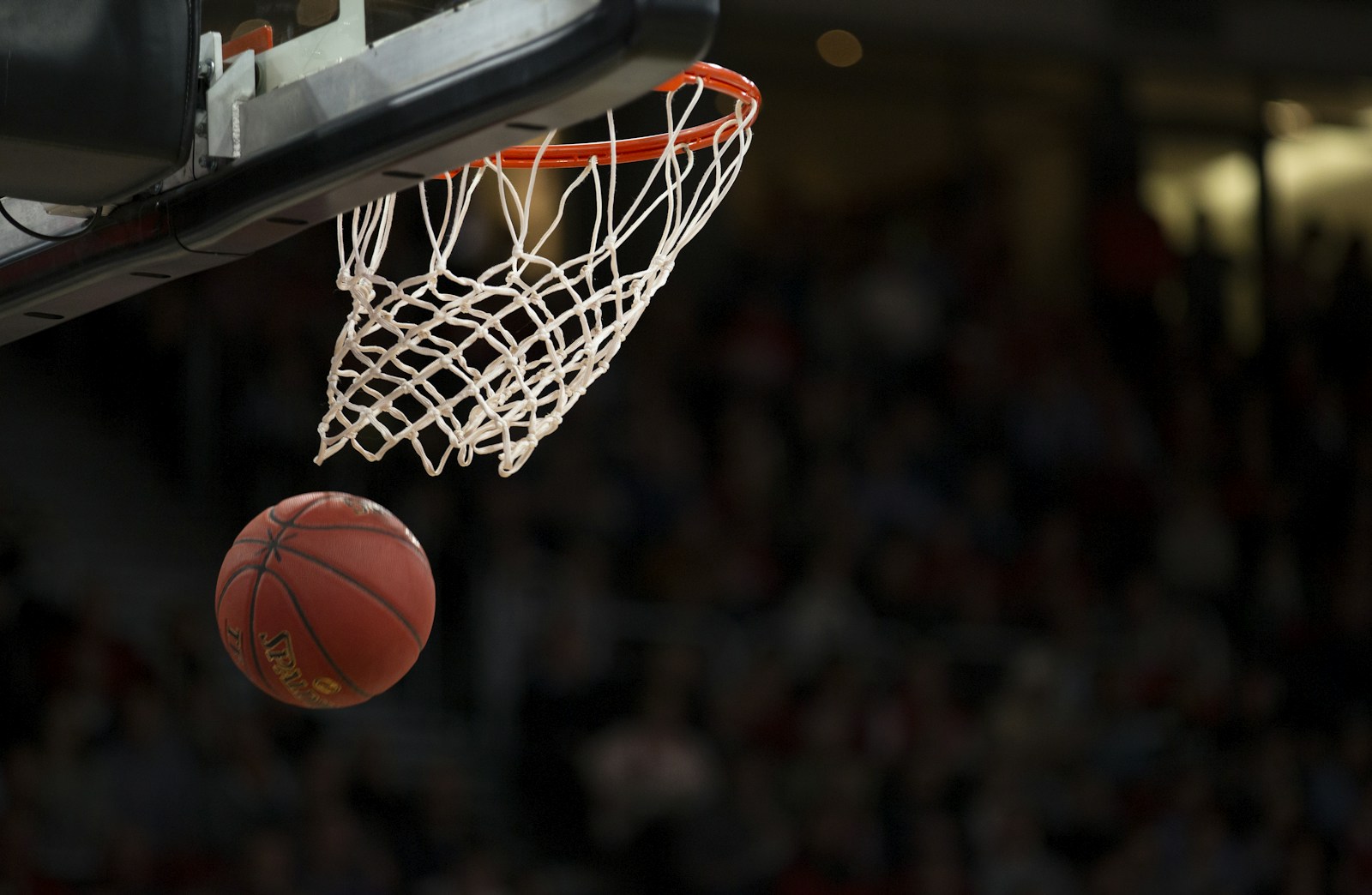 Basketball action on an outdoor court